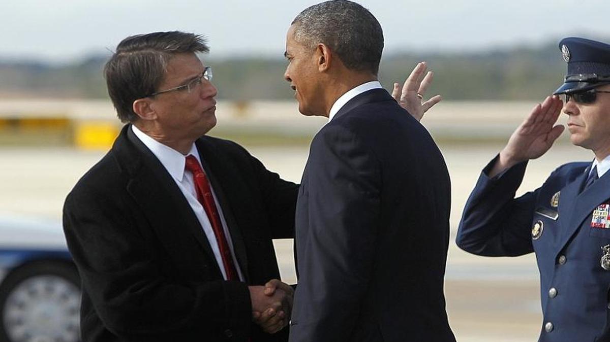 
President Barack Obama is greeted by N.C. Gov. Pat McCrory after arriving on Air Force One Wednesday, January 15, 2014, at RDU International Airport in Raleigh, N.C. (Travis Long/Raleigh News & Observer)
