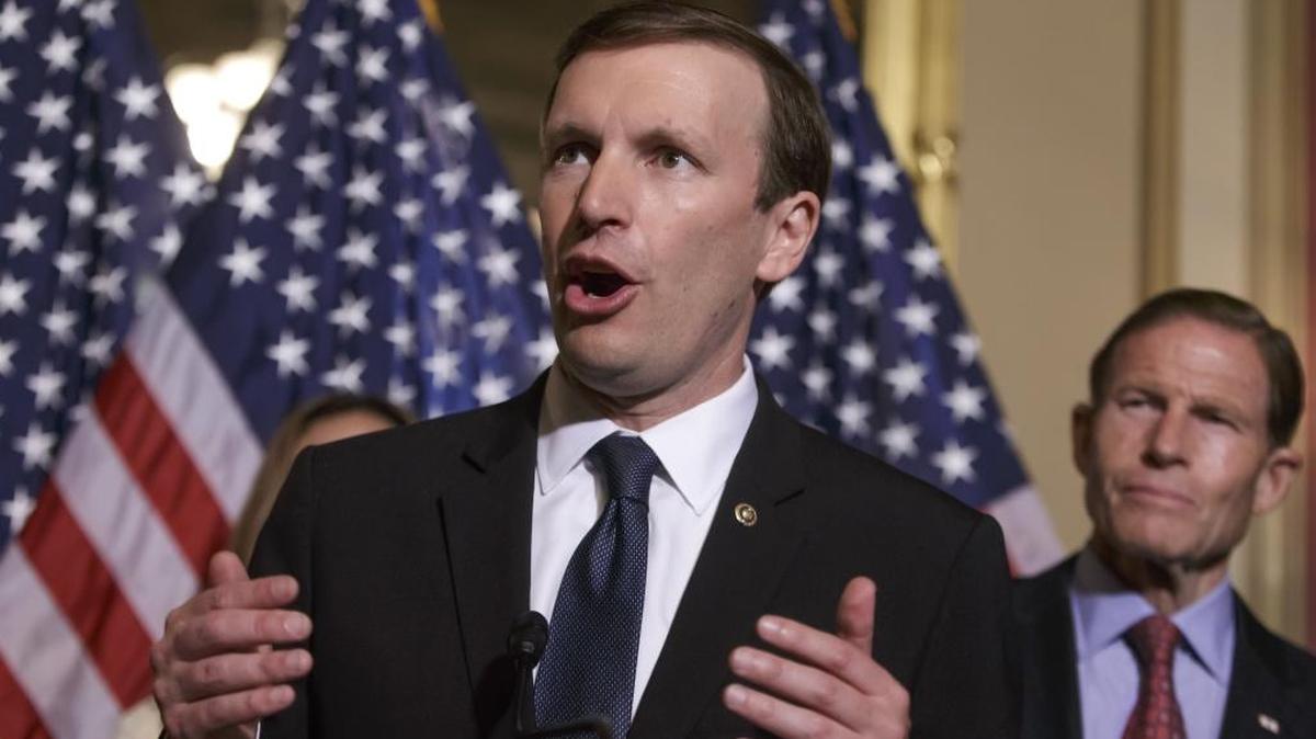 In this June 16, 2016 file photo, Sen. Chris Murphy, D-Conn., left, accompanied by Sen. Richard Blumenthal, D-Conn., speaks on Capitol Hill in Washington.