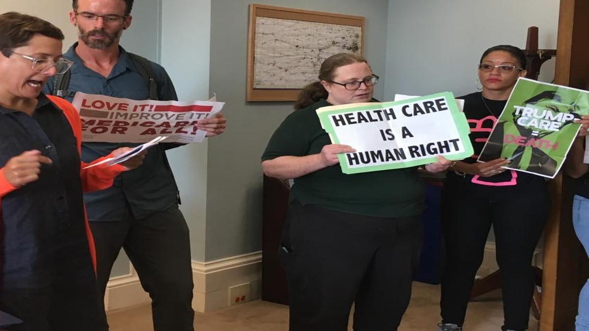 Kansas State University adjunct professor Jess Kerr speaks in Kansas Sen. Jerry Moran's office on Wednesday,about why the Affordable Care Act should not be repealed.