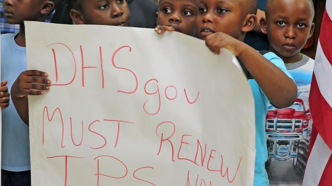 Kids of parents under Temporary Protected Status gather while speakers address the media at the FANM office in Little Haiti, on Monday. Immigration advocates held the press conference in reaction to the possibility that TPS may be terminated for more than 300,000 Haitians and Central Americans.