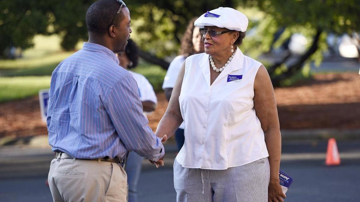 Rep. Alma Adams, D-N.C., right, greets voter Jermaine Jackson as he arrives to cast his vote in Charlotte, N.C., on June 7, 2016.