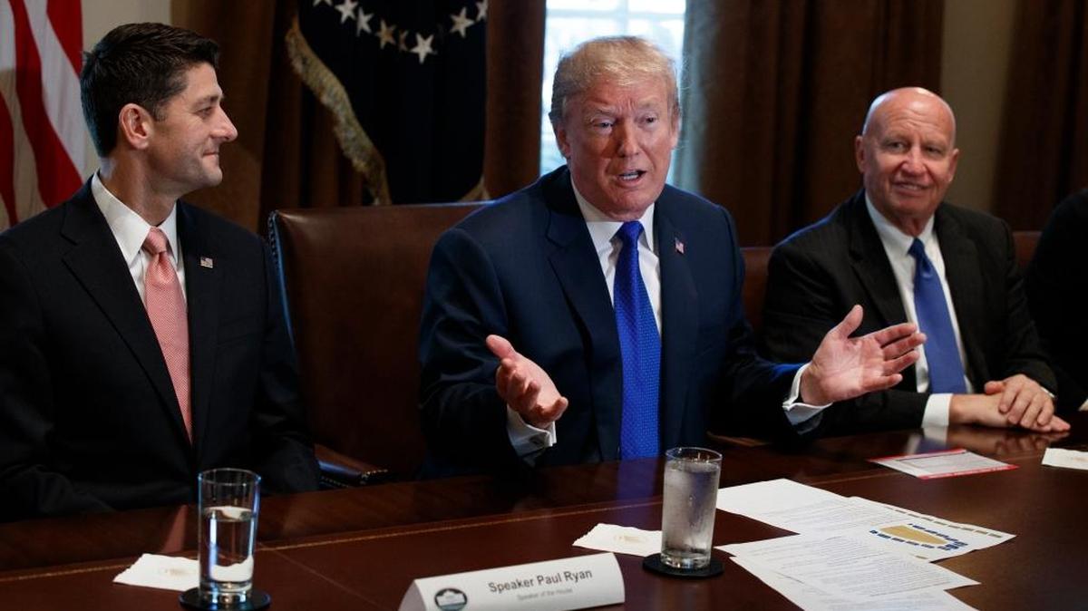 President Donald Trump speaks during a meeting on tax policy in the Cabinet Room of the White House, Thursday with House Speaker Paul Ryan of Wis., and Chairman of the House Ways and Means Committee Rep. Kevin Brady, R-Texas, right.