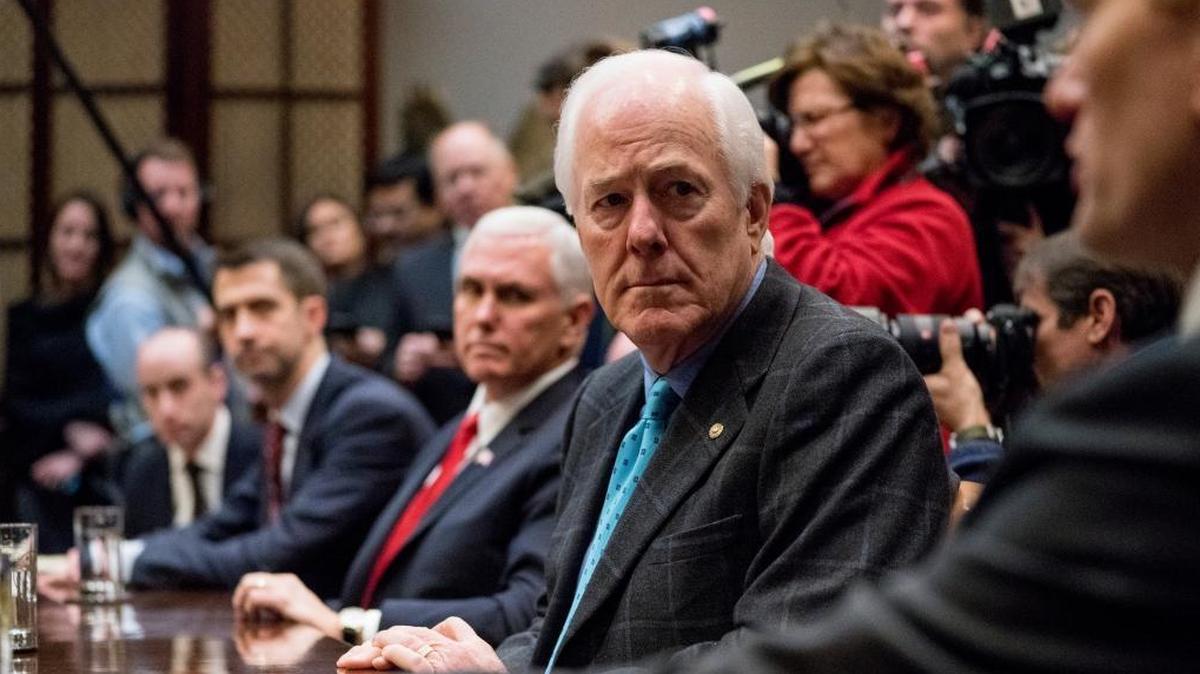 From left, President Donald Trump's White House Senior Adviser Stephen Miller, Sen. Tom Cotton, R-Ark., Vice President Mike Pence and Senate Majority Whip Sen. John Cornyn, R-Texas. attend a meeting with President Donald Trump on immigration in the Roosevelt Room at the White House Thursday.