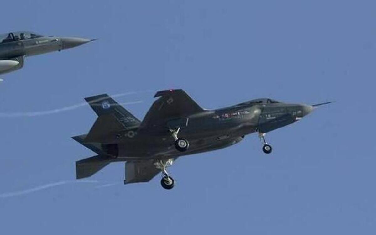 An F-16 (left) escorts the first F-35 built at Lockheed Martin Aeronautics off the runway at NAS Fort Worth JRB Carswell Field on Dec. 15, 2006.