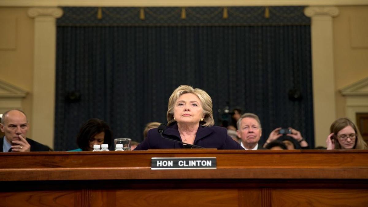 Hillary Clinton takes her seat on Capitol Hill in Washington on Thursday, Oct. 22, 2015, to testify before the House Benghazi Committee.