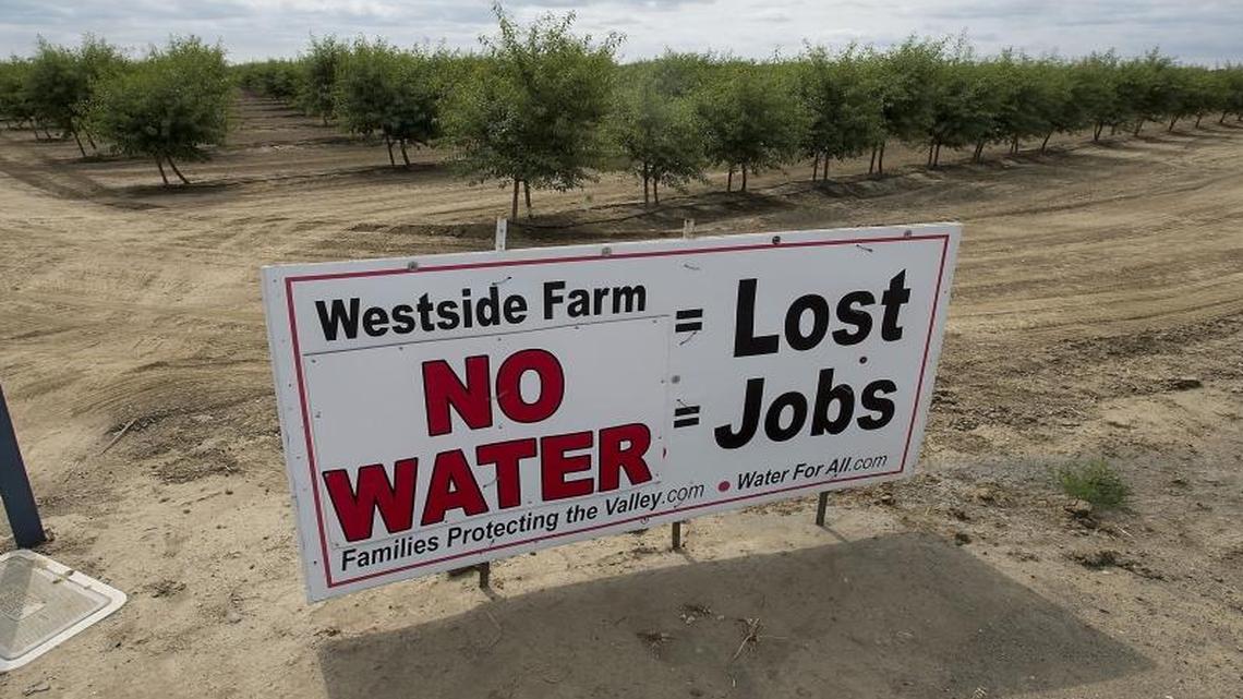 Signs like this one dot the landscape around farms near Huron, Calif., on May 21, 2015. Dan Errotabere grows almonds, tomatoes and other crops in the Westlands Water district west of Fresno.
