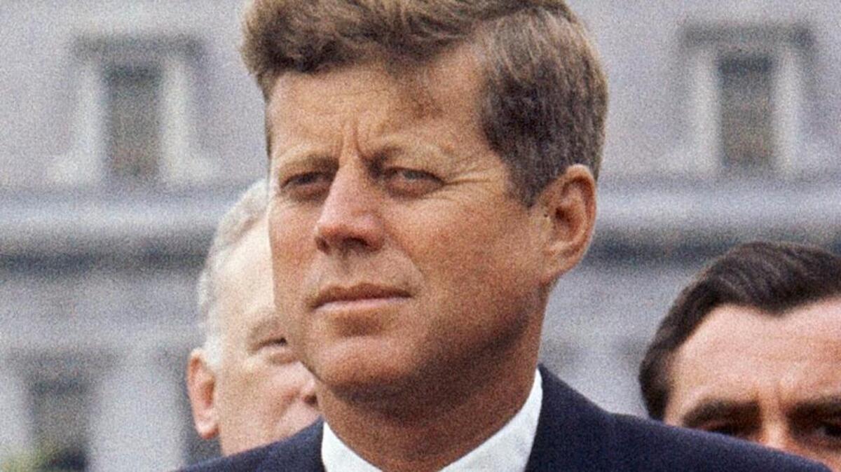 FILE - In this April 30, 1963 file photo, President John F. Kennedy listens while Grand Duchess Charlotte of Luxembourg speaks outside the White House in Washington. The National Archives has until Oct. 26, 2017, to disclose the remaining files related to Kennedy's Nov. 22, 1963 assassination, unless President Donald Trump intervenes.