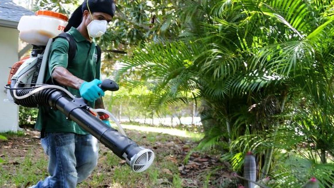A spray technician with Pinellas County Mosquito Control uses a fogger to distribute VectoBac, a biopesticide engineered to kill mosquito larvae, into plants behind a home in Oldsmar, Fla., on Aug. 23, 2016. Efforts in Congress to reach a bipartisan deal on funding to fight Zika failed earlier this summer.