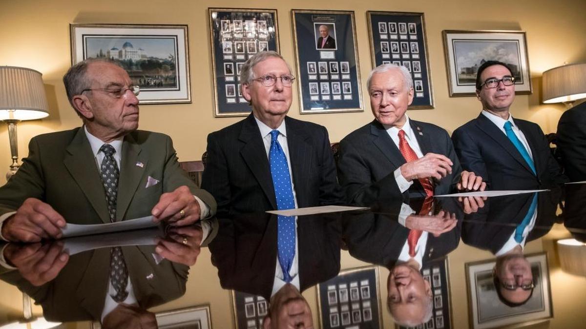 From left, Senate Judiciary Committee Chairman Chuck Grassley, R-Iowa, Senate Majority Leader Mitch McConnell, R-Ky., Senate Finance Committee Chairman Orrin Hatch, R-Utah, and Treasury Secretary Steven Mnuchin, make statements to reporters as work gets underway on the Senate's version of the GOP tax reform bill.