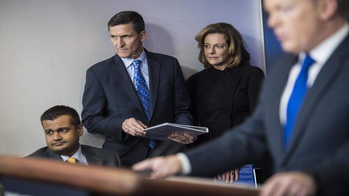 Former national security adviser Michael Flynn, center left, and K.T. McFarland, deputy national security adviser, center, listen as White House press secretary Sean Spicer speaks on Feb. 1, 2017.