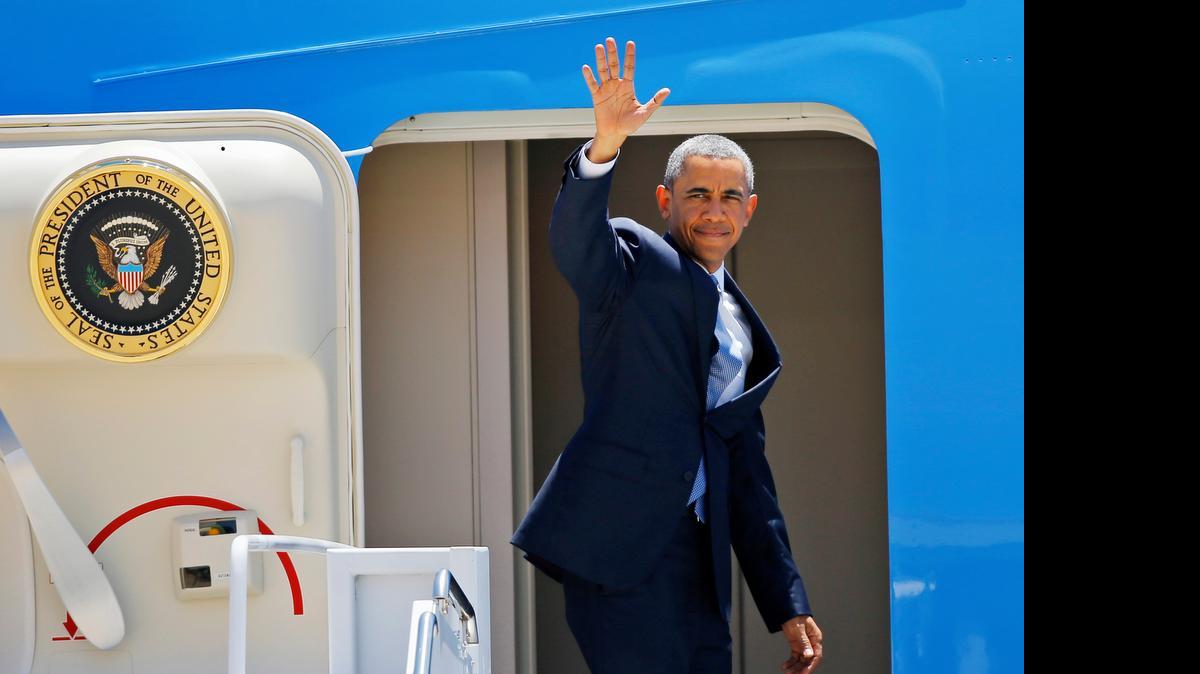 
President Barack Obama waves before boarding Air Force One at Tinker Air Force Base, Okla., Thursday, July 16, 2015, after visiting the El Reno Federal Correctional Institution, becoming the first sitting president to set foot inside a federal prison and meet with incarcerated men there.
