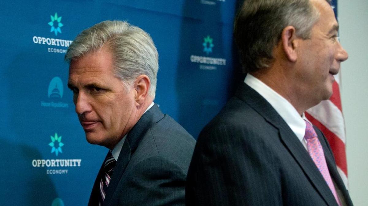 
House Majority Leader Kevin McCarthy of Calif., left, squeezes behind outgoing House Speaker John Boehner of Ohio at the start of a news conference on Capitol Hill in Washington, Tuesday, Sept. 29, 2015. McCarthy is assuring Republicans he can bring them together, even as emboldened conservatives maneuver to yank their party to the right in the wake of the leader of the U.S. House of Representatives Speaker John Boehner's sudden resignation. 
