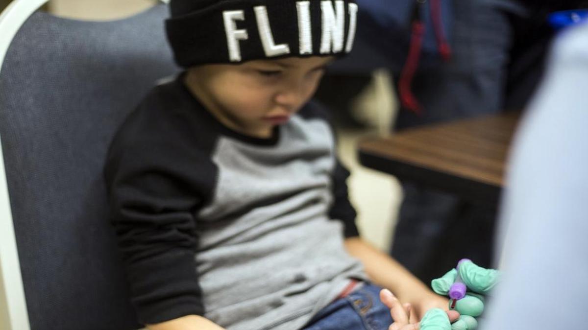Grayling Stefek, 5, has his blood drawn during a free lead-testing event and family fun night for children on Tuesday, Jan. 26, 2016, at Eisenhower Elementary school in Flint, Mich. The Flint water crisis has other government leaders thinking about the issue of lead poisoning.