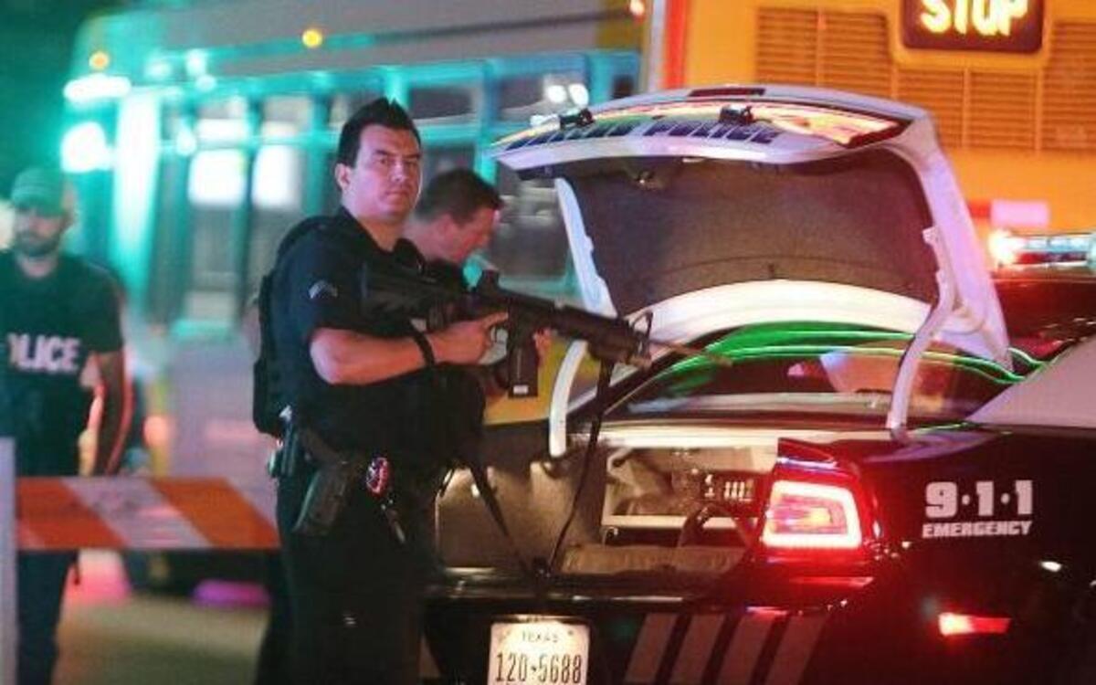 Police blocked streets in downtown Dallas early Friday as they investigated Thursday night’s shootings.