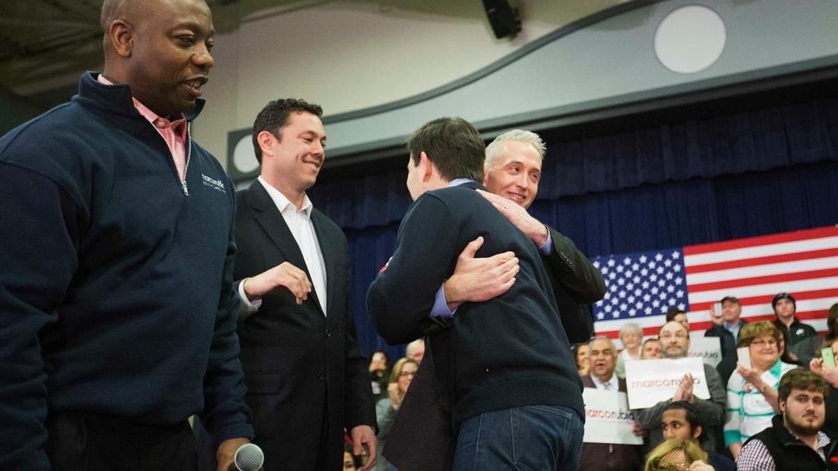 Sen. Tim Scott, R-S.C., from left, Rep. Jason Chafetz, R-Utah, and Rep. Trey Gowdy, R-S.C., greet Republican presidential candidate, Sen. Marco Rubio, R-Fla., right, as they introduce him at a campaign event at Gilbert H. Hood Middle School Friday, Feb. 5, 2016, in Derry, N.H.