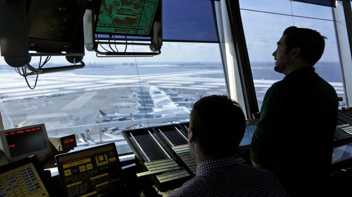 Air traffic controllers work in the tower at John F. Kennedy International Airport in New York, March 16, 2017. President Donald Trump is calling for privatizing the nation’s air traffic control operations in his budget proposal, a top priority of the airline industry.