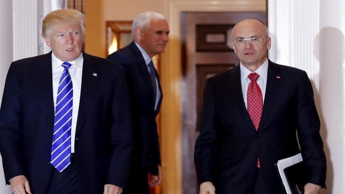 In this Nov. 19, 2016 file photo, then-President-elect Donald Trump walks Labor Secretary-designate Andrew Puzder from Trump National Golf Club Bedminster clubhouse in Bedminster, N.J.