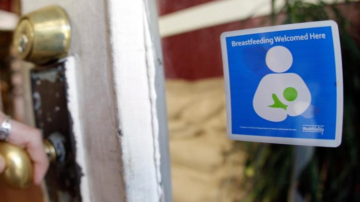 A decal reading “Breastfeeding Welcomed Here” is displayed on the door to a store in Nashville, Tenn. Congress on Wednesday gave final approval to a bill that would require the federal government to study the health risks that women face from taking medication while breast-feeding.