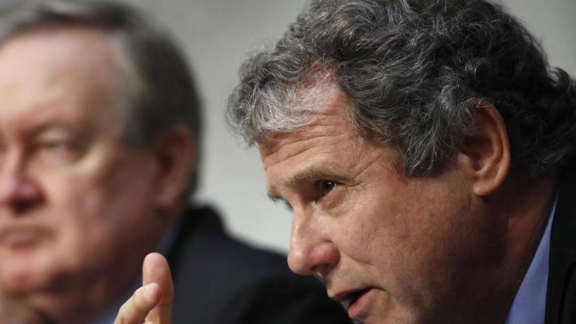 Chairman of the Senate, Housing, and Urban Affairs Committee Sen. Michael Crapo, R-Idaho, sits left, as ranking member Sen. Sherrod Brown, D-Ohio, questions Jerome Powell, President Donald Trump's nominee for chairman of the Federal Reserve, during a Senate Banking, Housing, and Urban Affairs Committee confirmation hearing on Capitol Hill in Washington, Tuesday, Nov. 28, 2017.