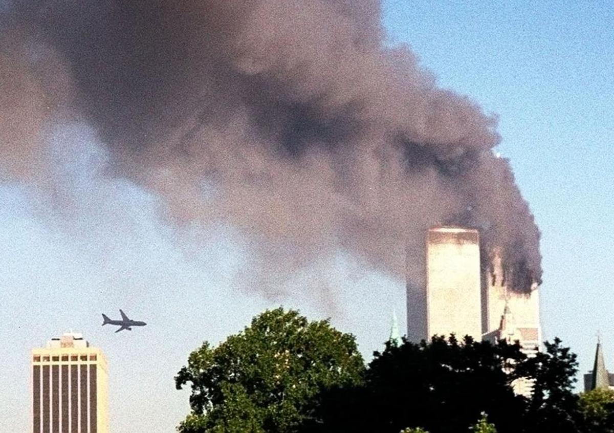 The second hijacked jet approaches New York’s World Trade Center moments before it struck the tower at left, as seen from downtown Brooklyn, Tuesday, Sept. 11, 2001. In an unprecedented show of terrorist horror, the 110-story towers collapsed in a shower of rubble and dust after 2 hijacked airliners carrying scores of passengers slammed into them.