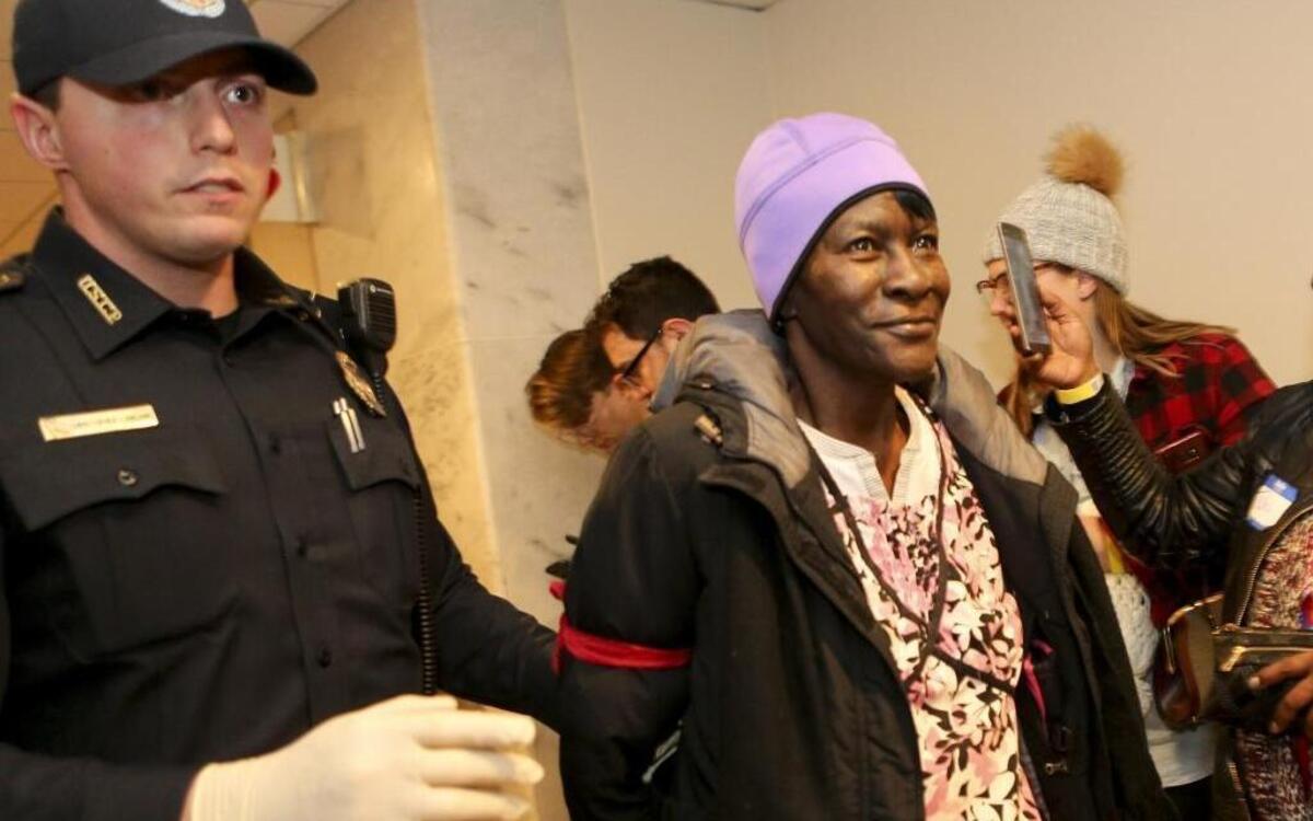 Alice Allen of Missouri, 67, who is semi-retired, is arrested in the Hart Senate Building during a protest against the repeal of the Affordable Care Act in Washington, D.C., on Tuesday, Jan. 31, 2017. A group made up of health care workers, people with pre-existing conditions and faith leaders let themselves be arrested on Capitol Hill to register dissent to Republicans' plans to repeal the Affordable Care Act, also known as Obamacare. About 50 people from 20 states were arrested for breaking the law against protesting in a Senate office building.