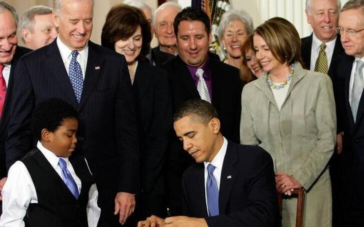 FILE - In this Tuesday, March 23, 2010 file photo, President Barack Obama signs the Patient Protection and Affordable Care Act in the East Room of the White House in Washington. "Obamacare" led to health care coverage for some 20 million Americans, including about 4 million Hispanics and 3 million blacks, according to federal statistics. However, its fate is uncertain because of Trumpâ€™s vow to repeal and replace it.