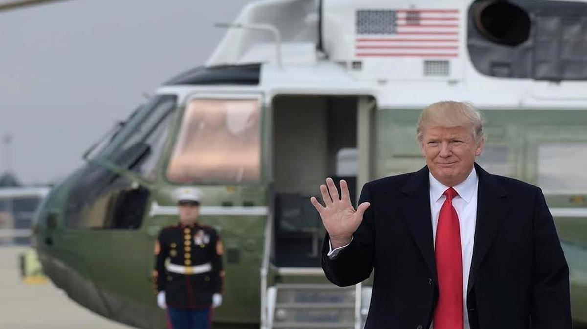 In this Feb. 3, 2017, file photo, President Donald Trump waves as he walks from Marine One to board Air Force One at Andrews Air Force Base, Md. Trump was heading to Florida to spend the weekend at Mar-a-Lago.