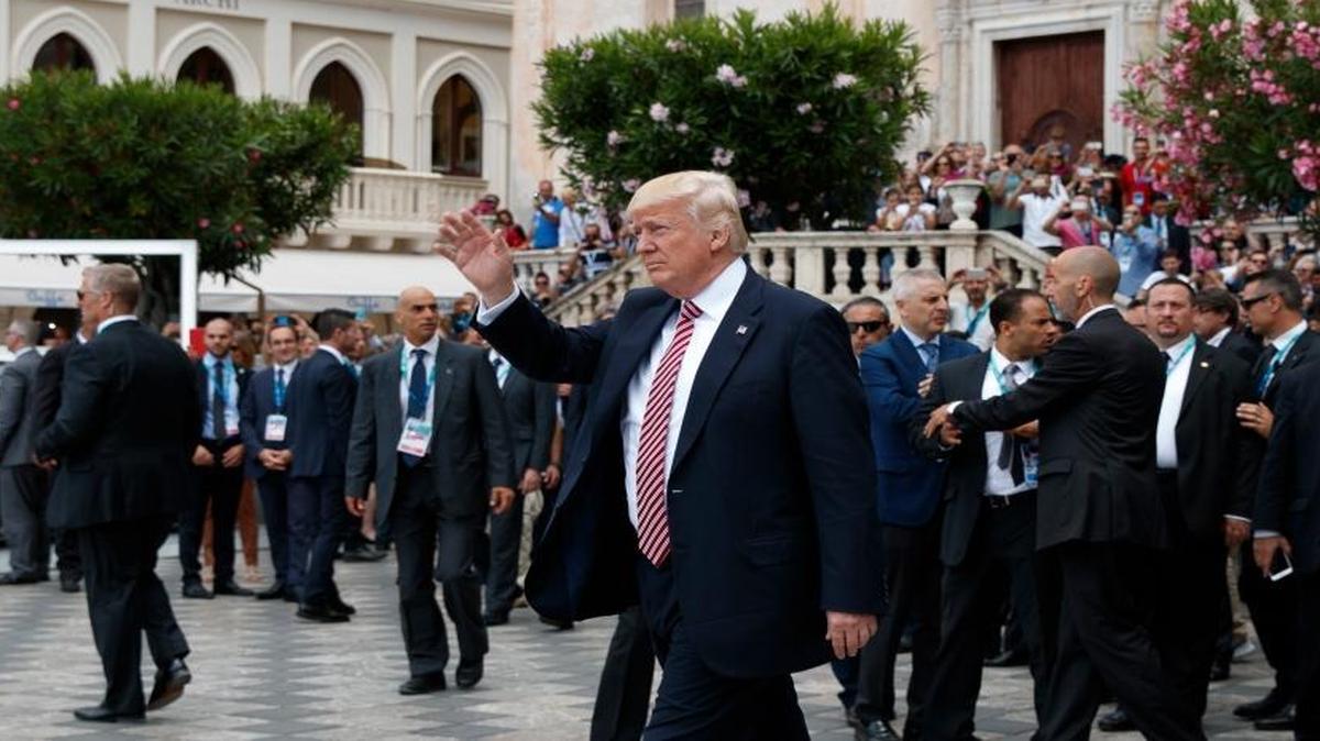 President Donald Trump waves as he takes a walking tour during the G-7 Summit, Friday, May 26, 2017, in Taormina, Italy.