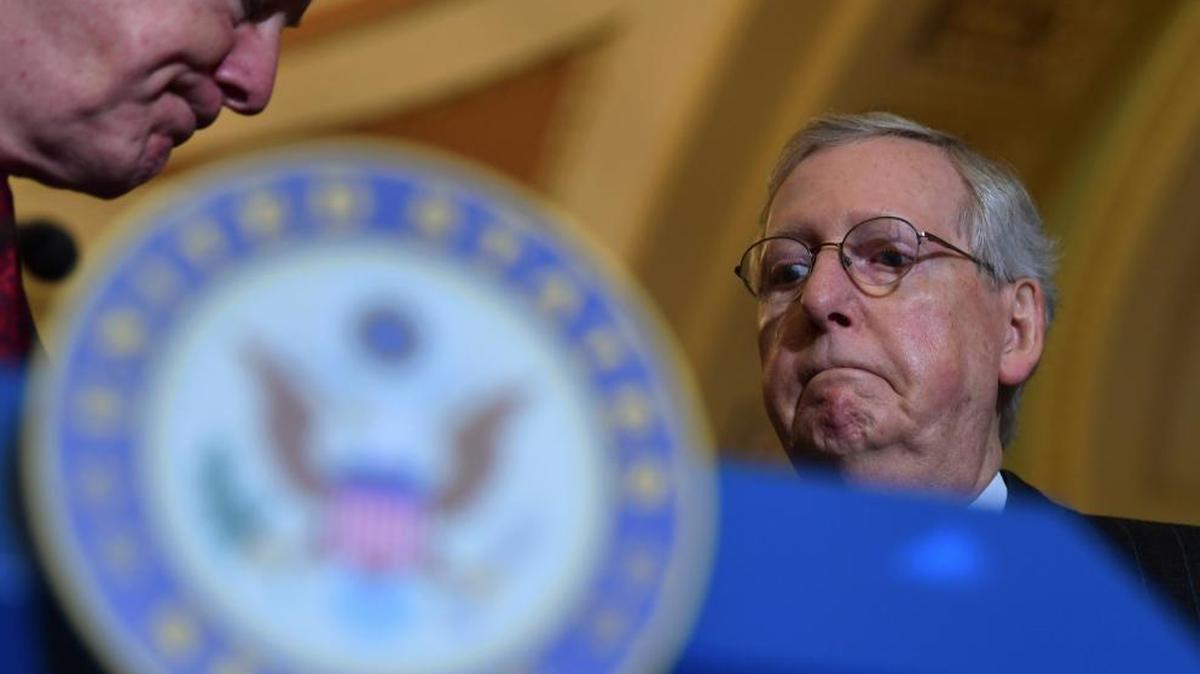 Senate Majority Leader Mitch McConnell of Ky., right, listens as Sen. John Cornyn, R-Texas, left, finishes speaking to reporters following the weekly Republican policy luncheon on Capitol Hill in Washington last week.