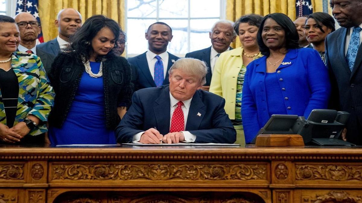 President Donald Trump signs the Historically Black Colleges and Universities HBCU Executive Order in the Oval Office in the White House in Washington.