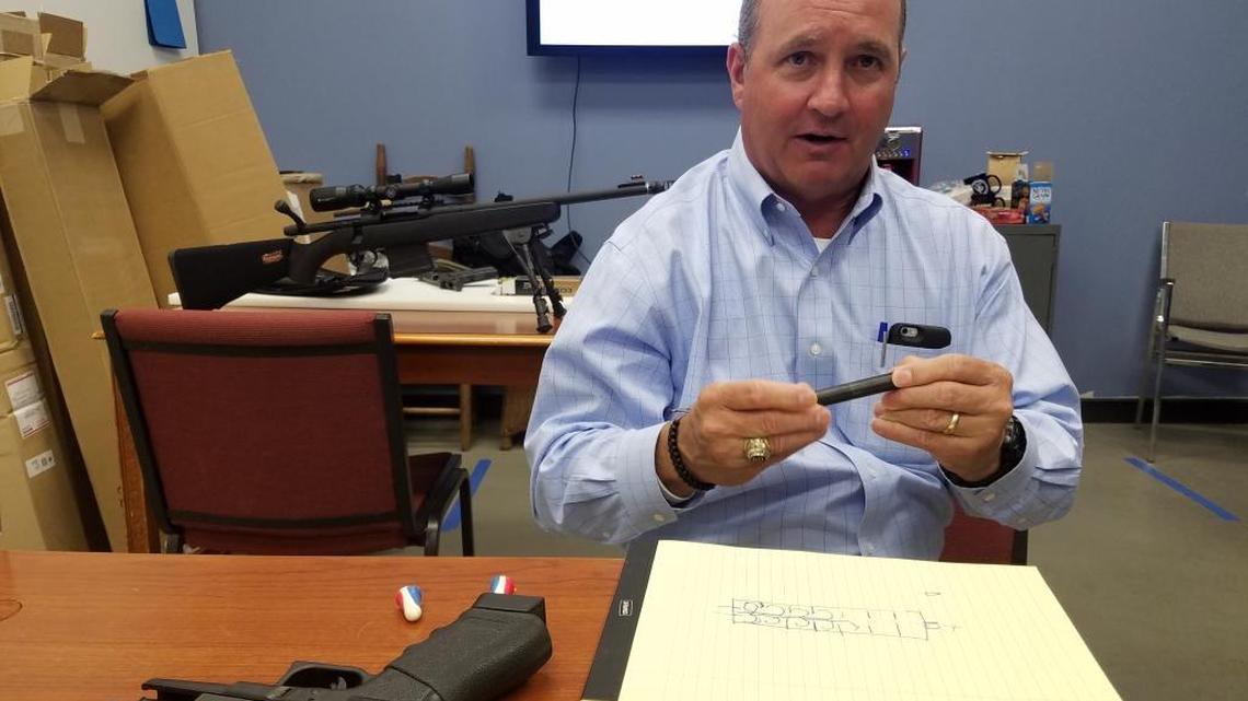 Rep. Jeff Duncan, R-S.C., discusses suppressors inside Nalley Arms, a gun store in Easley, S.C.
