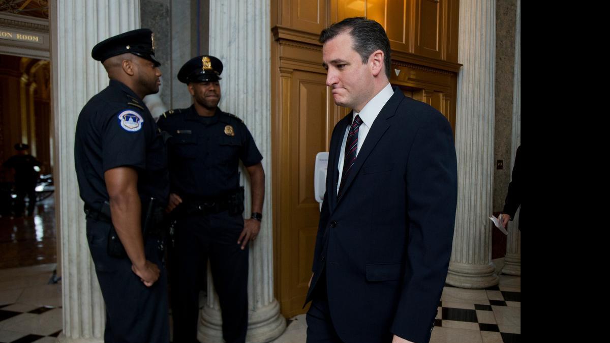 
Sen. Ted Cruz, R-Texas, arrives for a Senate session on Capitol Hill in Washington, Sunday, July 26, 2015. On the agenda for the rare Sunday session are efforts to repeal President Barack Obama's health care law and reviving the federal Export-Import Bank. 
