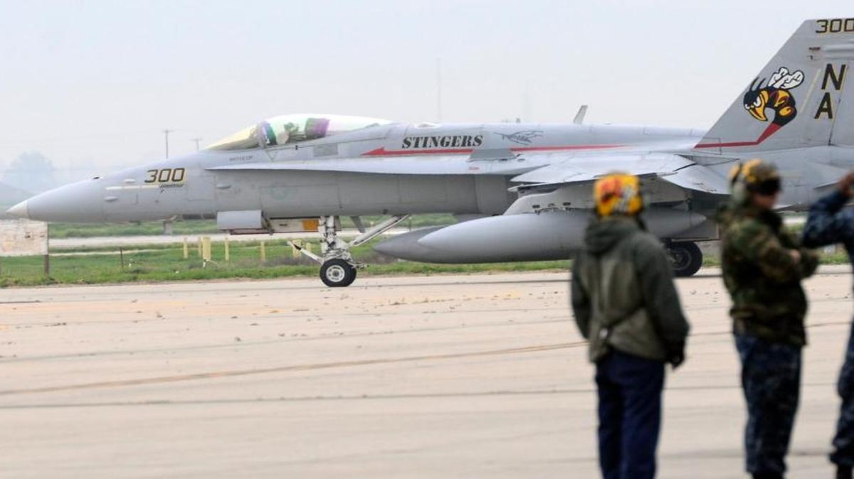 The flight crew stands by for the last F/A-1C Hornet flight out of Naval Air Station Lemoore on Feb. 17, 2016. It is being replaced by the F-35 Joint Strike Fighter.