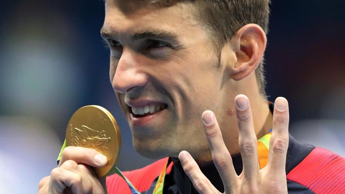 FILE - In this Aug. 11, 2016 file photo, United States' Michael Phelps celebrates winning the gold medal in the men's 200-meter individual medley during the swimming competitions at the 2016 Summer Olympics, in Rio de Janeiro, Brazil. The House will consider making winnings from the Olympics tax-exempt when lawmakers return to Washington next month.