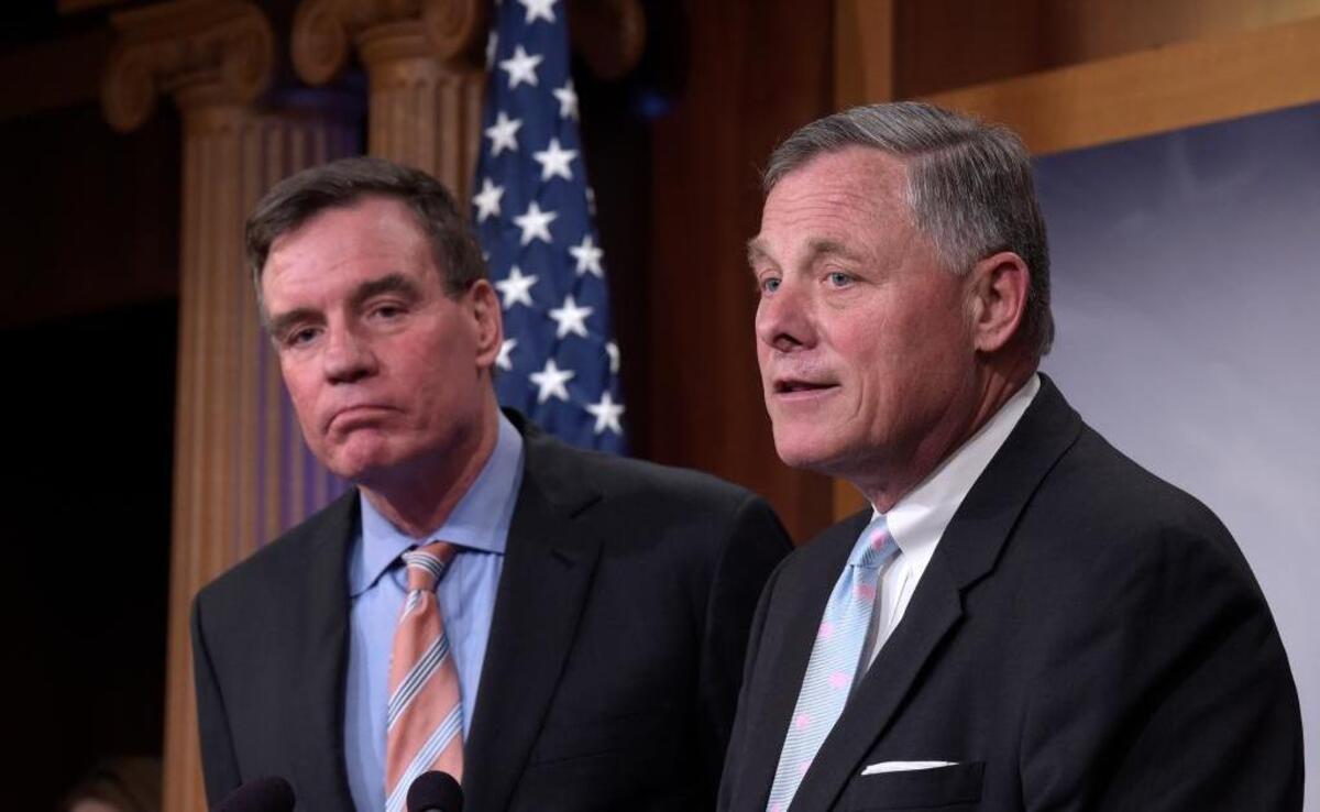 Senate Intelligence Committee Chairman Sen. Richard Burr, R-N.C., right, and the committee's Vice Chairman, Sen. Mark Warner, D-Va. meet with reporters on Capitol Hill in Washington, Wednesday, March 29, 2017, to discuss the committee's investigation of Russian interference in the 2016 election.