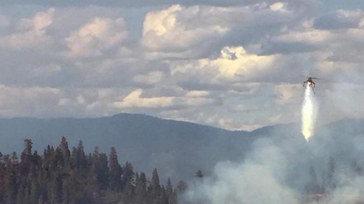 A fire crew makes a drop from a helicopter near Lowman, Idaho on Aug. 9, 2016. Proponents of transferring federal lands say that states and localities could better manage forest prone to wildfires. But some of those states and localities may not have the financial resources to manage these lands, and fight wildlifes.