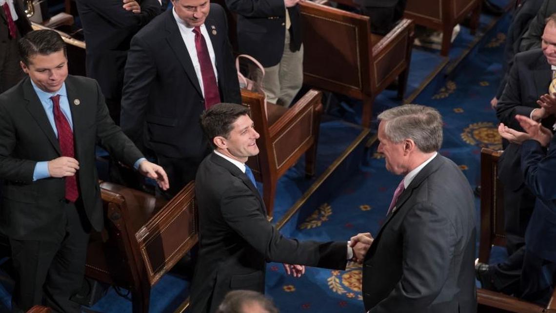 House Speaker Paul Ryan of Wis. shakes hands with Rep. Mark Meadows, R-N.C., right, as he is applauded following his re-election as speaker, during a ceremony in the House Chamber on Capitol Hill in Washington, Tuesday, Jan. 3, 2017.