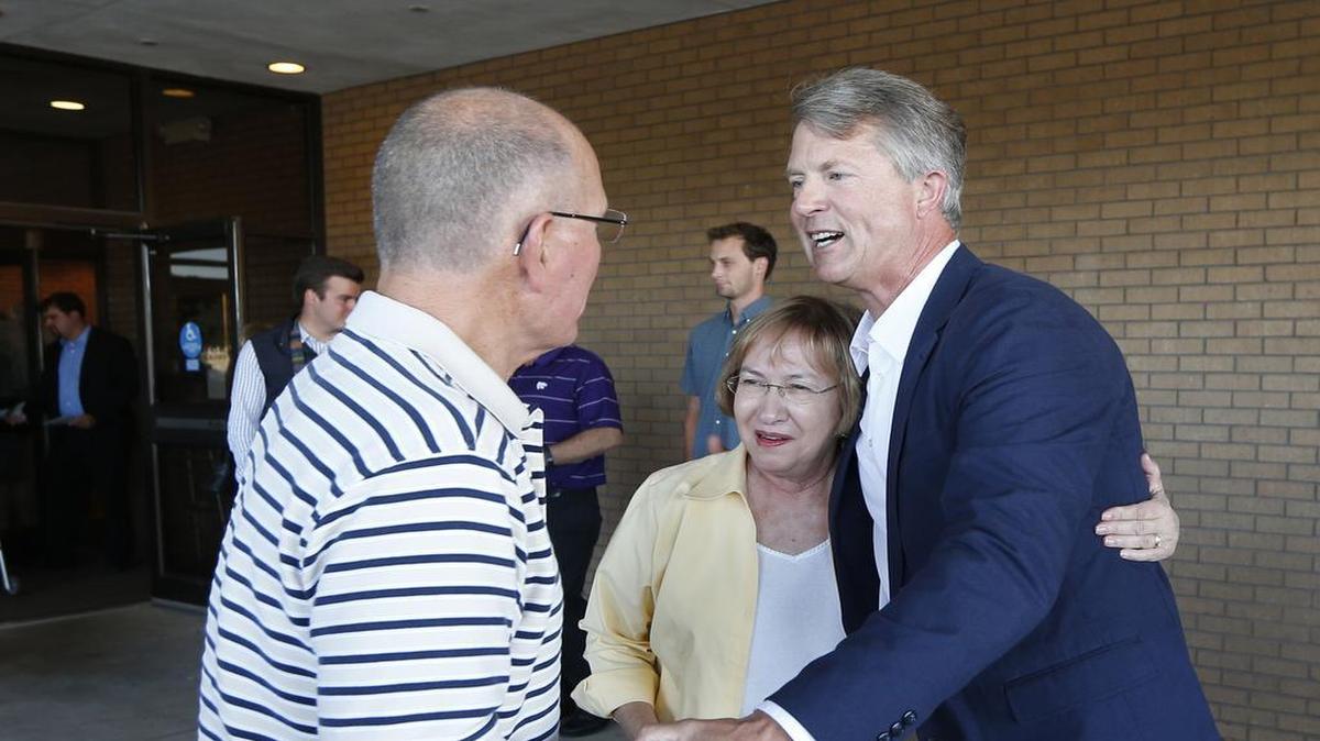 Kansas 1st Congressional District candidate Dr. Roger Marshall, right, visits with supporters who attended his debate with candidate congressman Tim Huelskamp in Hutchinson, Kan., on Wednesday, June 27, 2016.