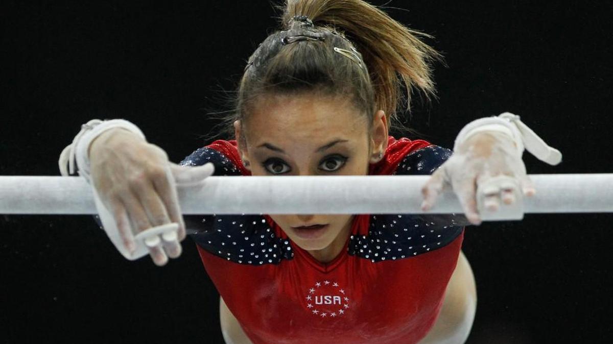 In this Oct. 17, 2010, file photo, Mattie Larson of the U.S. performs on the uneven bars during the women's qualifying session for the World Gymnastics Championships in Rotterdam, Netherlands. Larson, who was molested by Larry Nassar and was among the nearly 250 who gave victim impact statements during his sentencing, said the doctor cleared her one time to train at the Bela and Martha Karolyi complex in Texas on an ankle that turned out to be fractured.