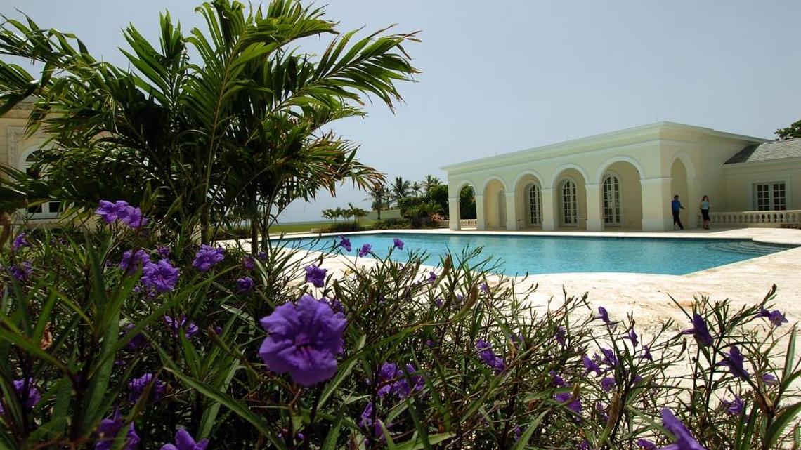 In this Aug. 1, 2006 file photo, the pool side flanks two buildings at Donald Trump’s Maison de l'Amitie in Palm Beach, Fla. Trump sold the Palm Beach mansion for about $95 million to a Russian billionaire, his spokeswoman said Wednesday July 16, 2008. Russian fertilizer billionaire Dmitry Rybolovlev purchased the roughly 60,000 square-foot (5,575-square-meter) oceanfront home, which Trump fixed up after buying it for about $41 million in 2004.