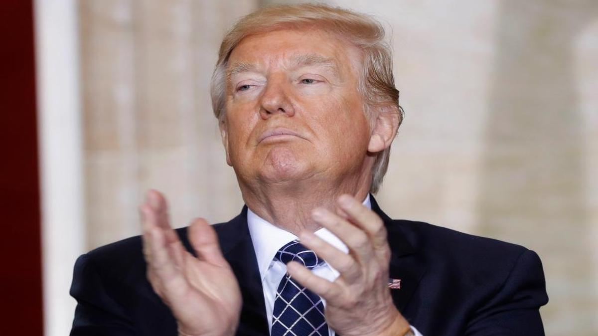 President Donald Trump applauds on Capitol Hill in Washington, Tuesday, April 25, 2017, during the U.S. Holocaust Memorial Museum's National Days of Remembrance ceremony.