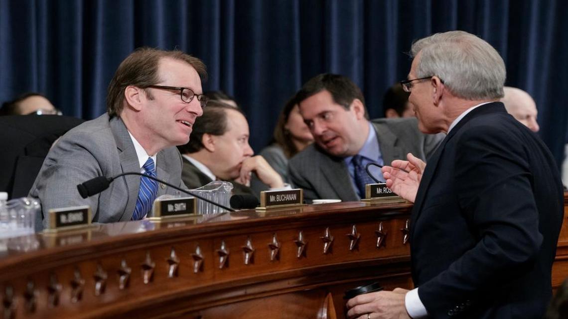 House Ways and Means Committee members Rep. Peter Roskam, R-Ill., left, and Rep. David Schweikert, R-Ariz., right, talk on Capitol Hill in Washington, Wednesday, March 8, 2017, as the committee began a markup of the long-awaited plan by Republicans to repeal and replace the Affordable Care Act. At rear are Rep. Pat Tiberi, R-Ohio and Rep. Devin Nunes, R-Calif., right.
