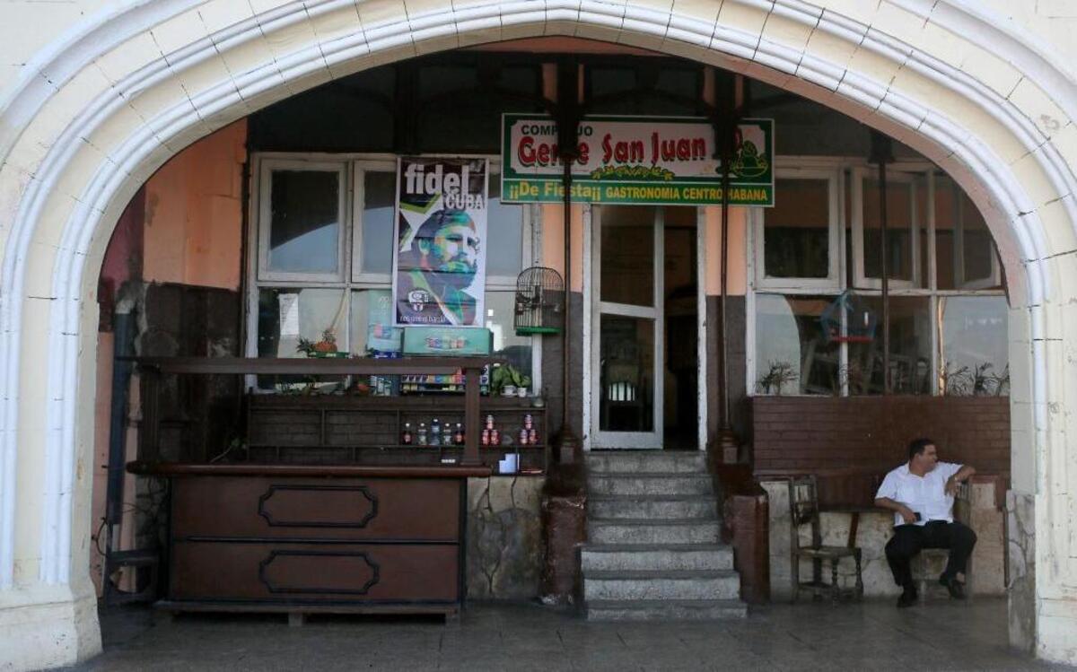 A restaurant worker sat outside his closed restaurant along the Malecon seafront in Havana, Monday, Nov. 28, 2016. The government declared a nine-day mourning period after the death of former leader Fidel Castro and banned the sale of alcohol, although some private and state-run restaurants catering to tourists are still serving beer, wine and spirits.