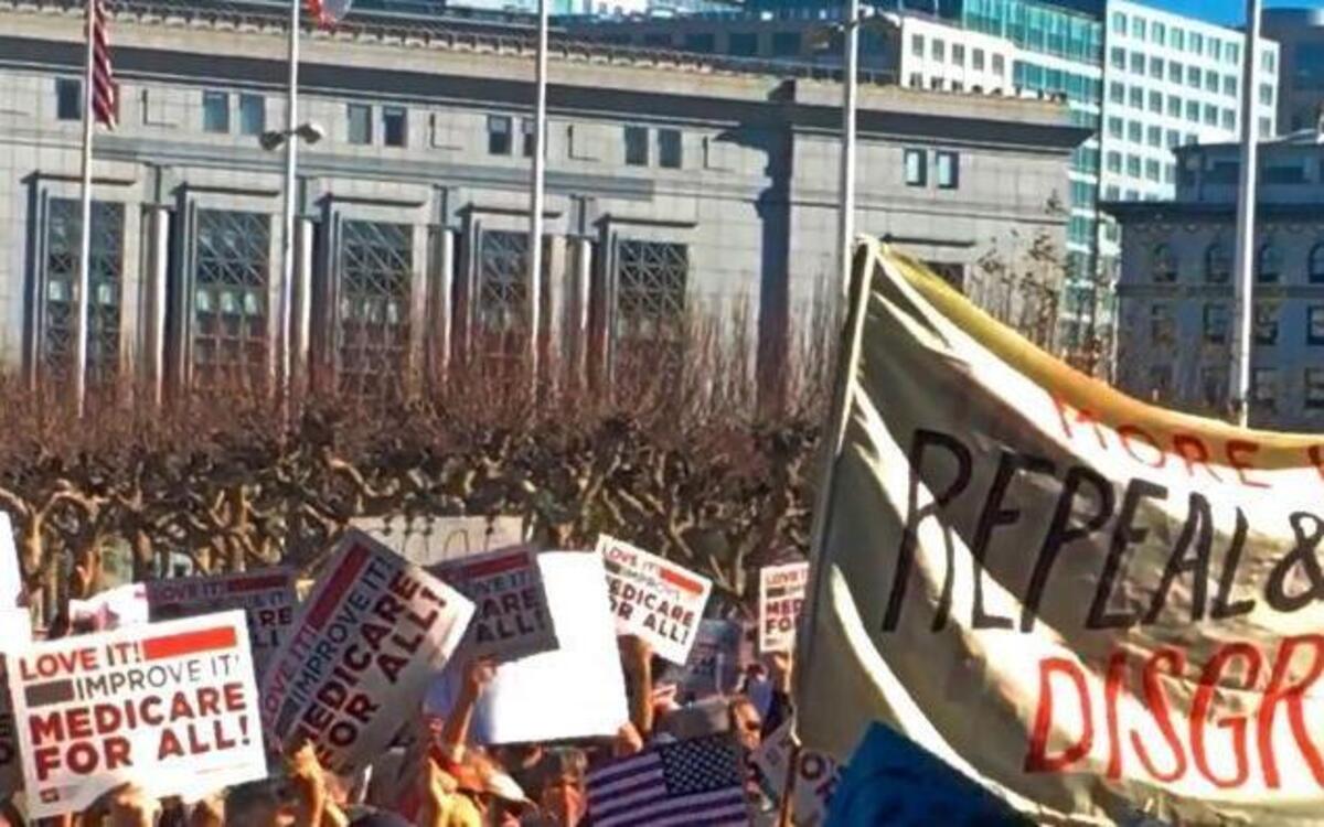 People rally against the dismantling of the Affordable Care Act during a gathering in San Francisco, Sunday, Jan. 15, 2017. It was one of dozens of rallies Democrats staged across the country to denounce Republican efforts to repeal President Barack Obama's health care law.