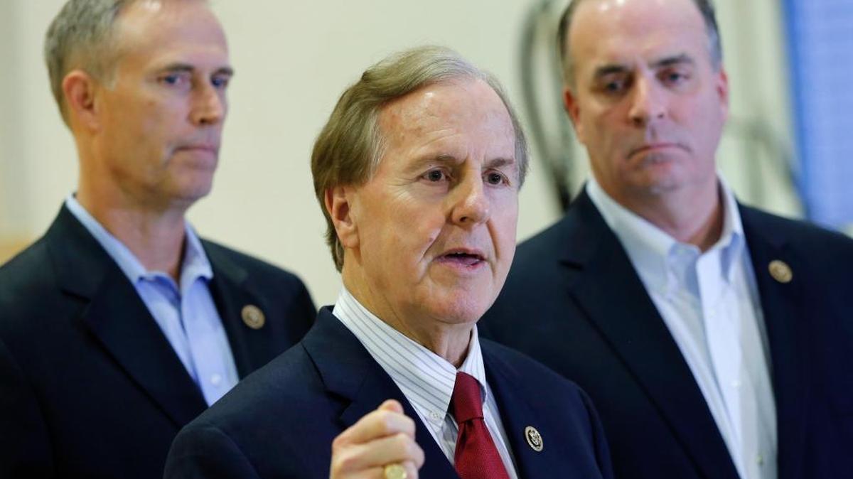 U.S. Representatives Robert Pittenger, center, Dan Kildee, right, and Jared Huffman, left, talk to the media at the Landstuhl Regional Medical Center in Landstuhl, Germany, on Monday, Jan. 18, 2016. Four U.S. citizens who were released from an Iranian prison had been transferred to Landstuhl for medical treatment.