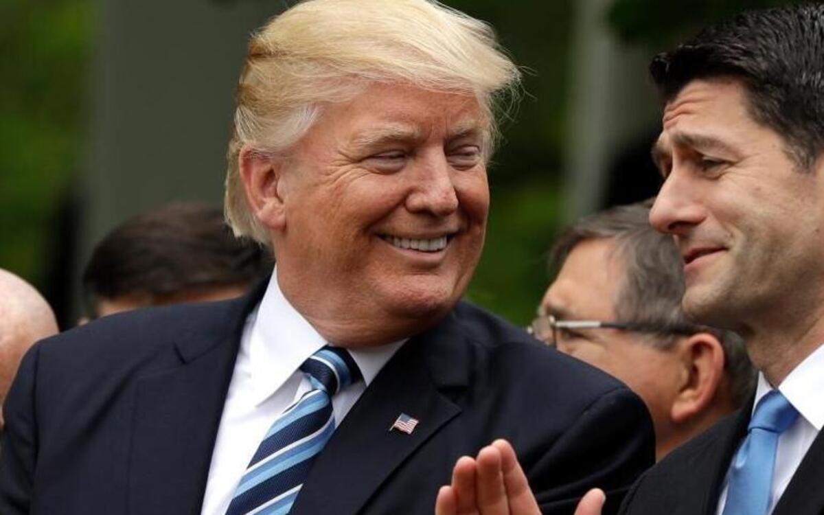 FILE - In this May 4, 2017 file photo, President Donald Trump talks to House Speaker Paul Ryan of Wis. in the Rose Garden of the White House in Washington after the House pushed through a health care bill.