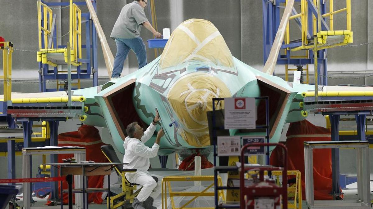 A F-35 is masked for the final finish coatings at Lockheed Martin Aeronautics in Fort Worth. ,