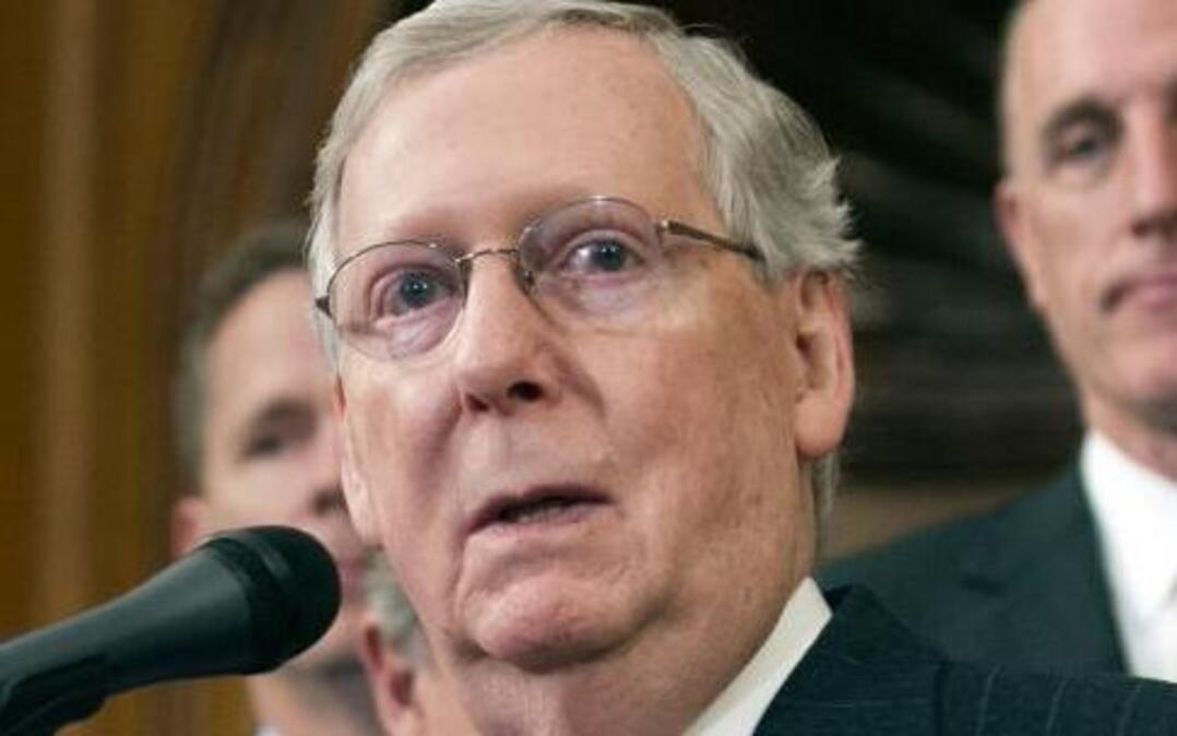 FILE - In this Dec. 8, 2016 file photo, House Speaker Paul Ryan of Wis., and others, listen as Senate Majority Leader Mitch McConnell of Ky., speaks on Capitol Hill in Washington. Republicans' grip on all levers of power stands as a mandate to the GOP-led Congress, which will move swiftly to try to undo eight years of outgoing President Barack Obama's agenda.