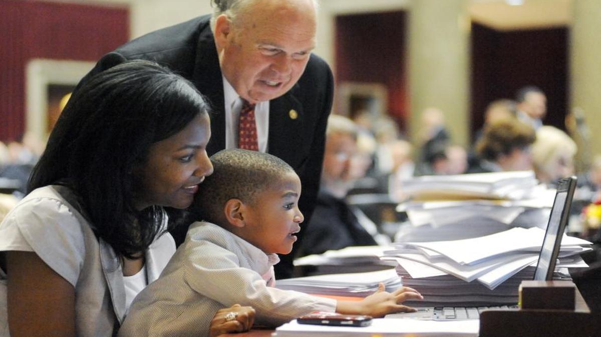 Tishaura Jones holds her son Aden, 2, while he checks out her computer on the last day of the regular legislative session Friday, May 14, 2010, in Jefferson City, Mo. Jones is a candidate for mayor of St. Louis endorsed by Democracy for America.