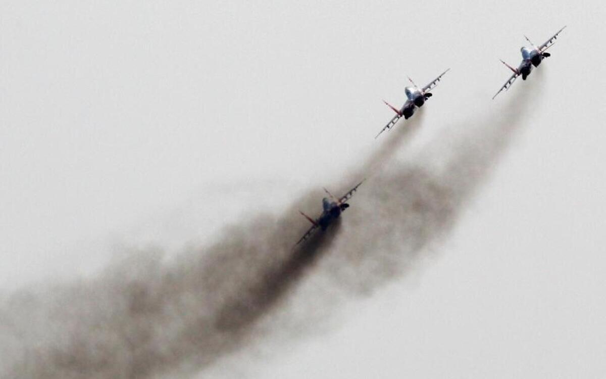 Russia’s military buildup continues at the planned pace despite its economic troubles. This photo, from Sept 1, 2012, from early in that buildup, show Mig-29 jet fighters of the Russian aerobatic team Strizhi (Swifts) performing in Batajnica, military airport near Belgrade, Serbia.